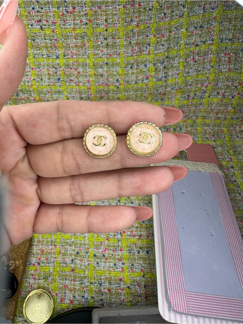 A great Chanel Pink Gold-Tone Logo Button Earrings